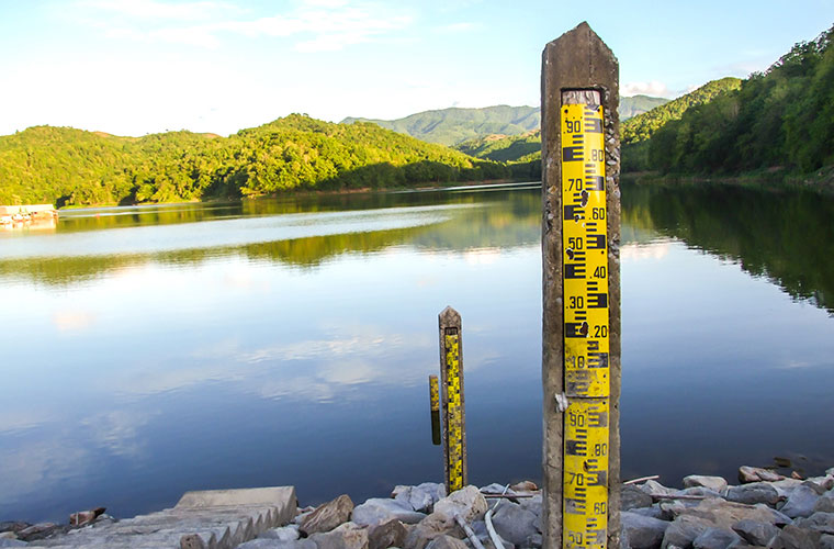 Multiple staff gauges to provide  water level measurements for a reservoir.