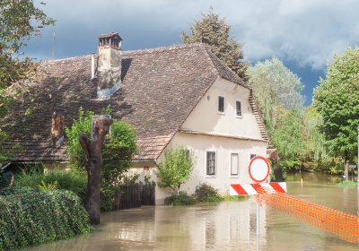 flood water surrounding a residential home