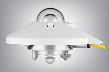 A Kipp & Zonen CMP22 pyranometer instrument showing a white sun shield, a double glass dome, and a yellow cable extending from the side.