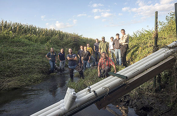 A group of researchers monitoring nitrate in an agricultural setting.